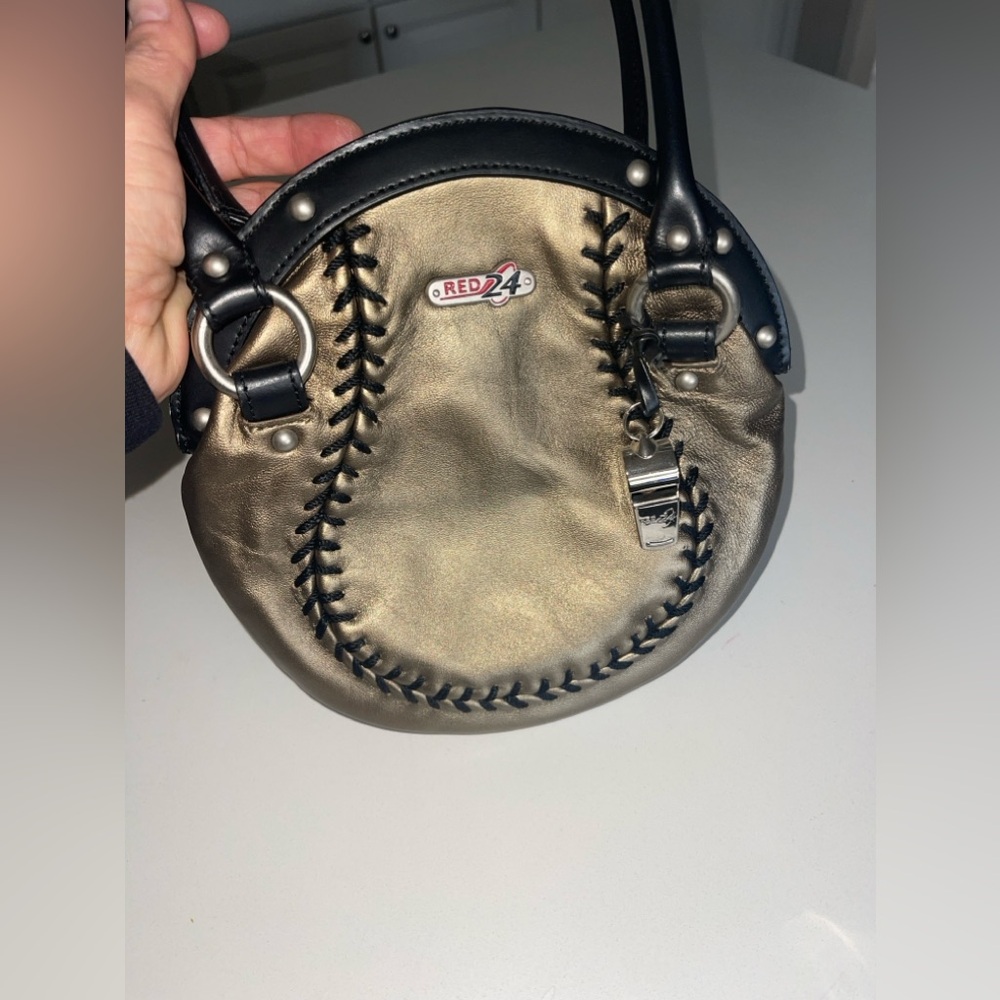 Gold leather baseball/softball purse.
